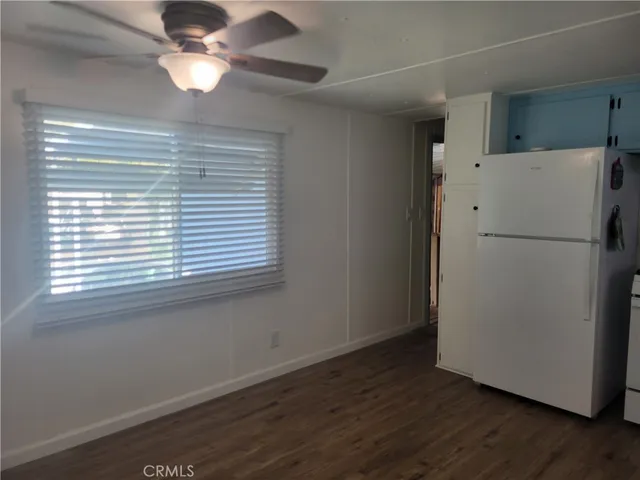 a white refrigerator freezer sitting in a kitchen
