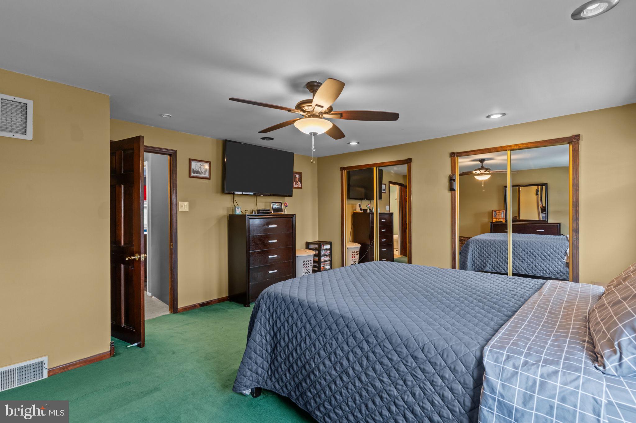 12413 Barbary Road Philadelphia, PA 19154 - Photo 15 of 29 a bedroom with a bed and a chandelier