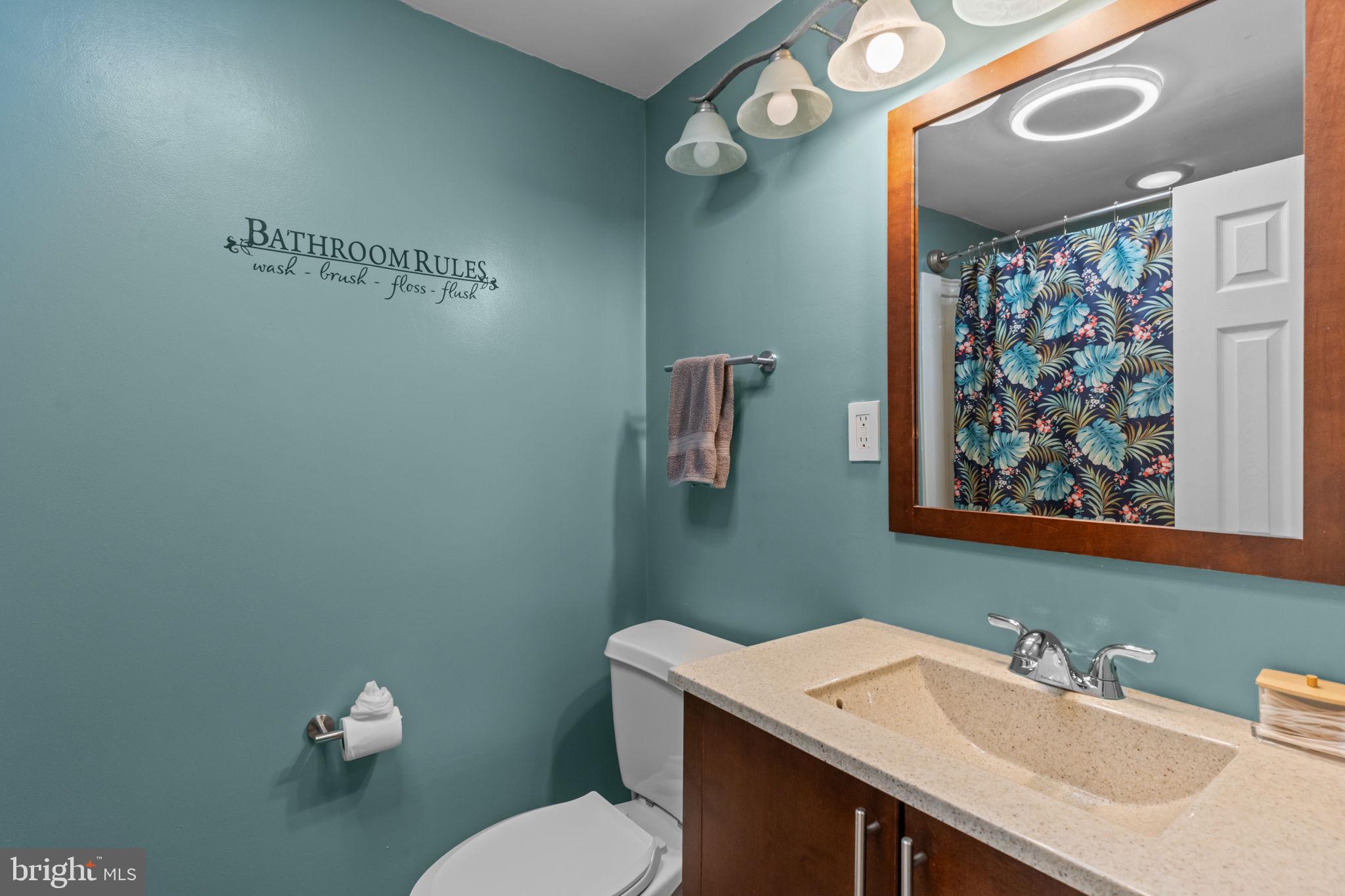 12413 Barbary Road Philadelphia, PA 19154 - Photo 16 of 29 a bathroom with a sink mirror and toilet