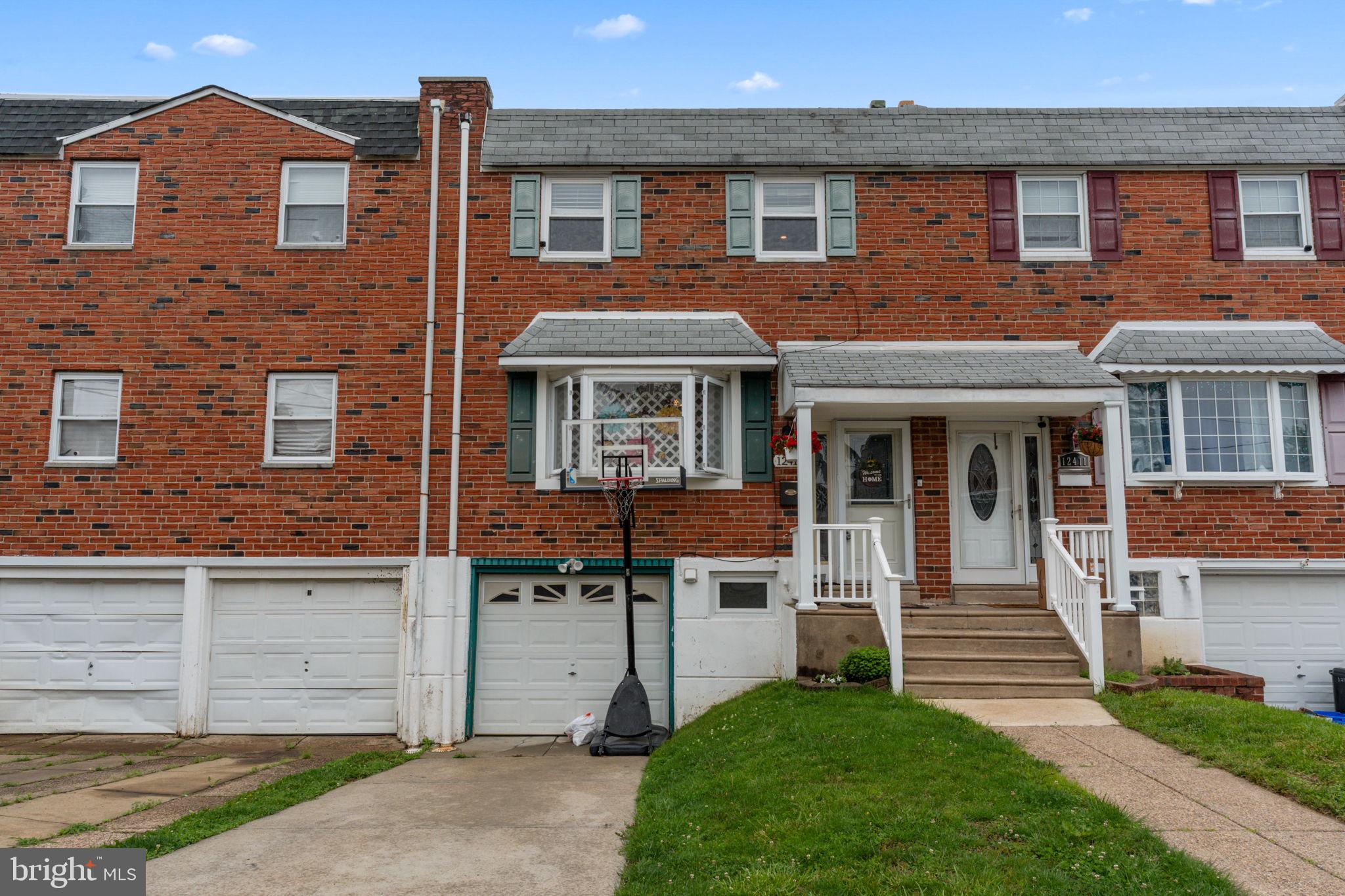 12413 Barbary Road Philadelphia, PA 19154 - Photo 2 of 29 a front view of a house with a yard