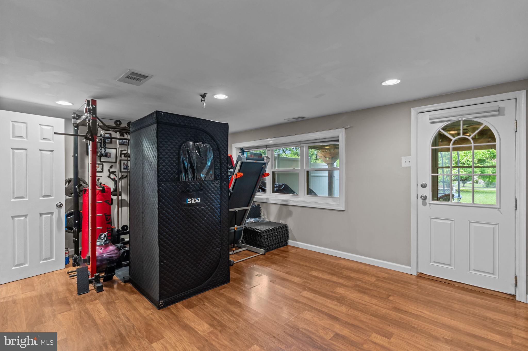 12413 Barbary Road Philadelphia, PA 19154 - Photo 23 of 29 a view of a room with gym equipment and a window