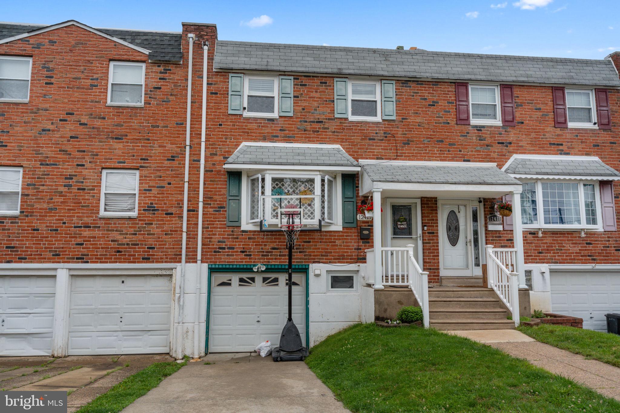 12413 Barbary Road Philadelphia, PA 19154 - Photo 3 of 29 a front view of a house with a yard