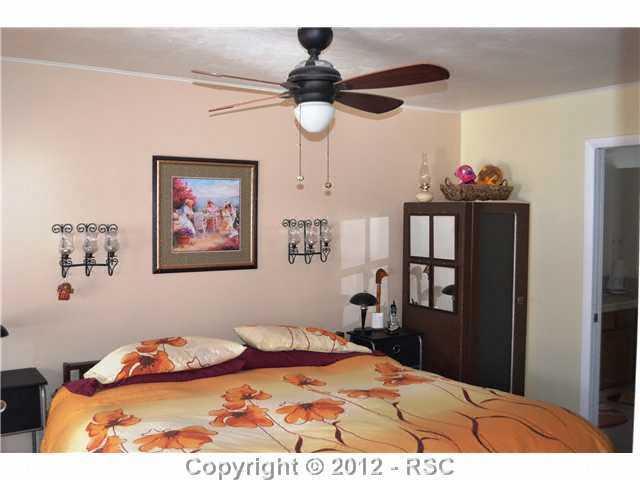 6755 Burrows Road Colorado Springs, CO 80908 - Photo 8 of 16 MASTER BEDROOM
