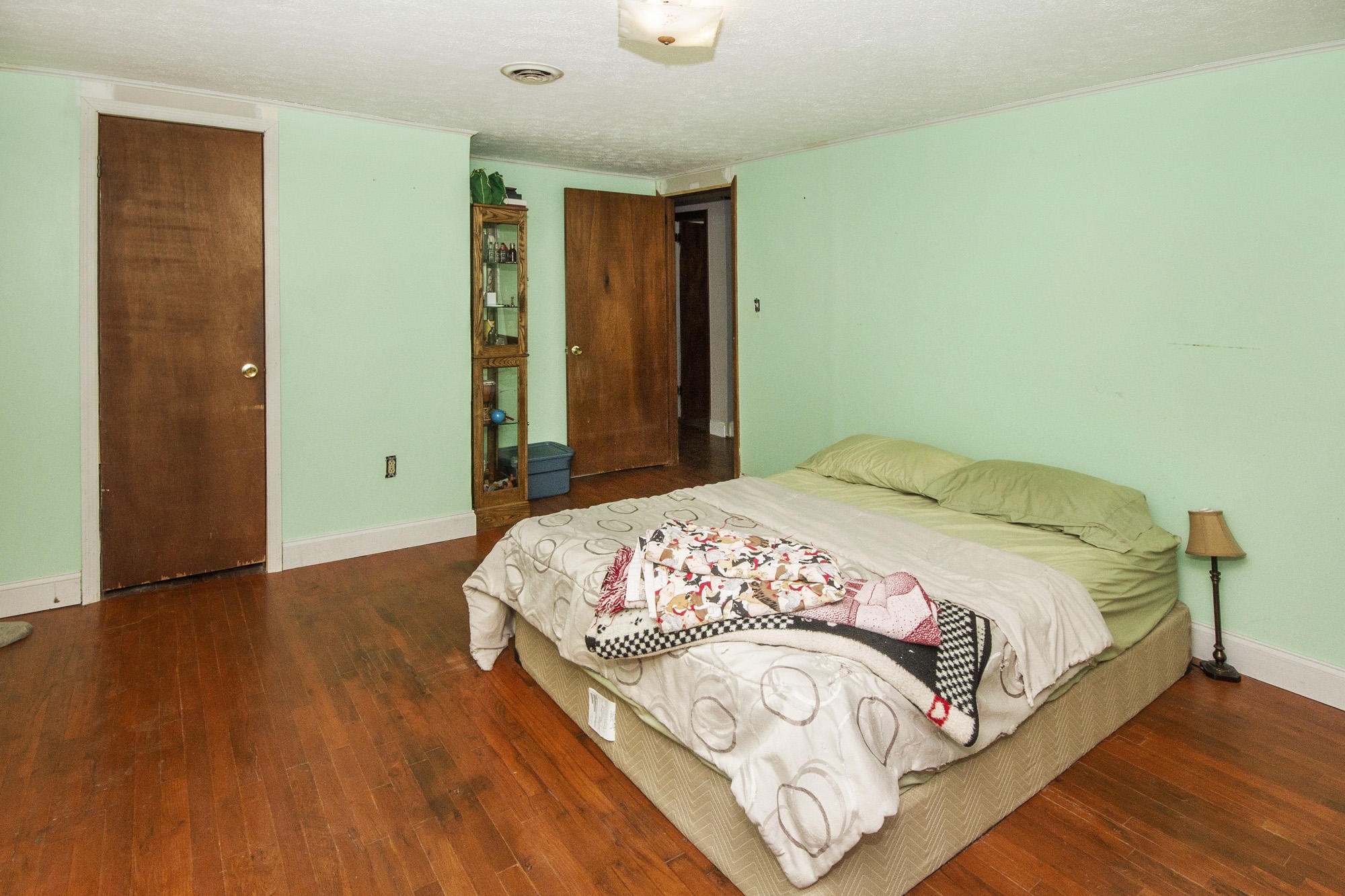 1201 Manley Road Rutledge, TN 37861 - Photo 16 of 27 a bedroom with a bed and a wooden floor