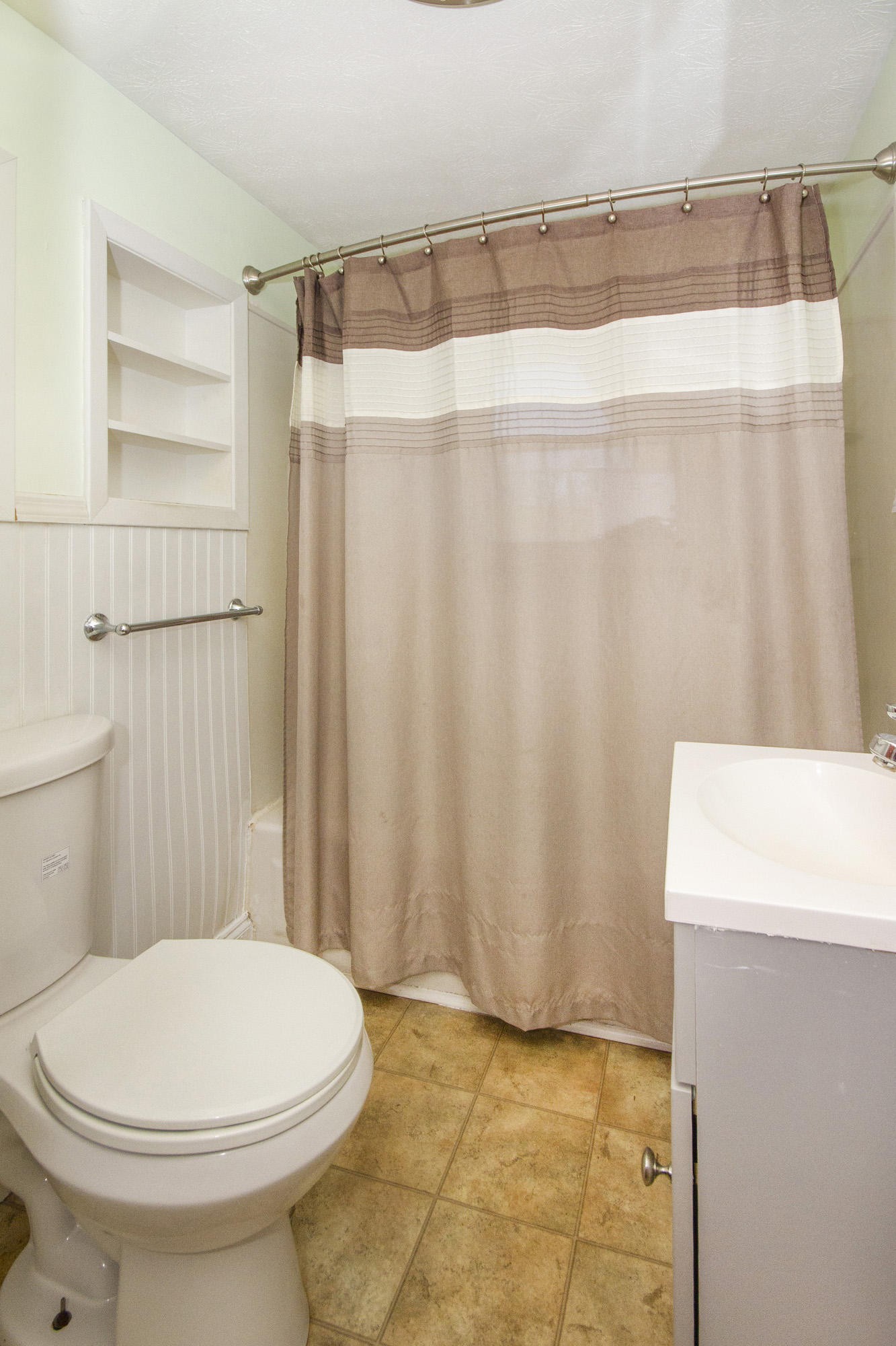 1201 Manley Road Rutledge, TN 37861 - Photo 17 of 27 a bathroom with a toilet a sink and curtain