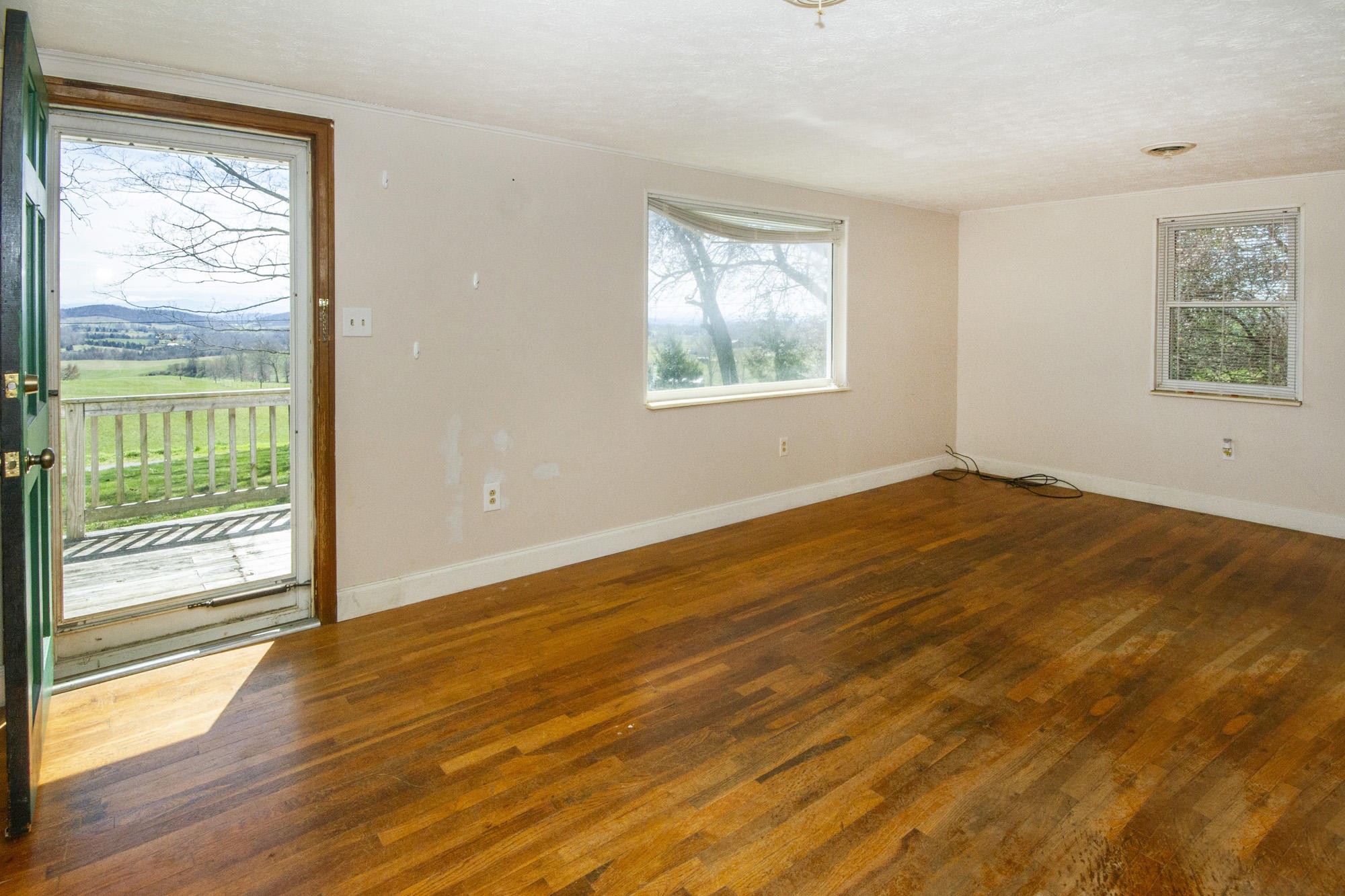 1201 Manley Road Rutledge, TN 37861 - Photo 9 of 27 a view of empty room with wooden floor and fan
