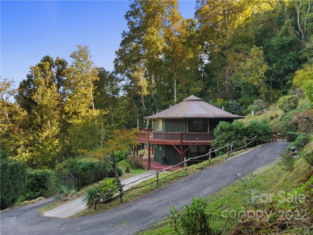 850 Mt Valley Road Waynesville, NC 28785 - Photo 3 of 22 a garden view with a seating space