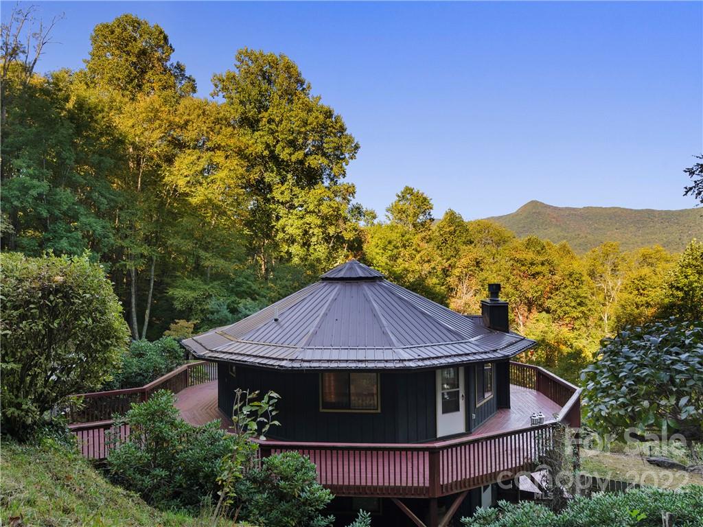 850 Mt Valley Road Waynesville, NC 28785 - Photo 4 of 22 a front view of a house with a yard and large tree