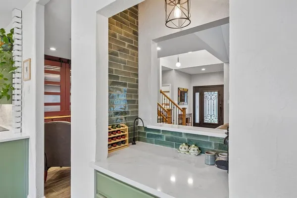 a bathroom with a sink a mirror and a window
