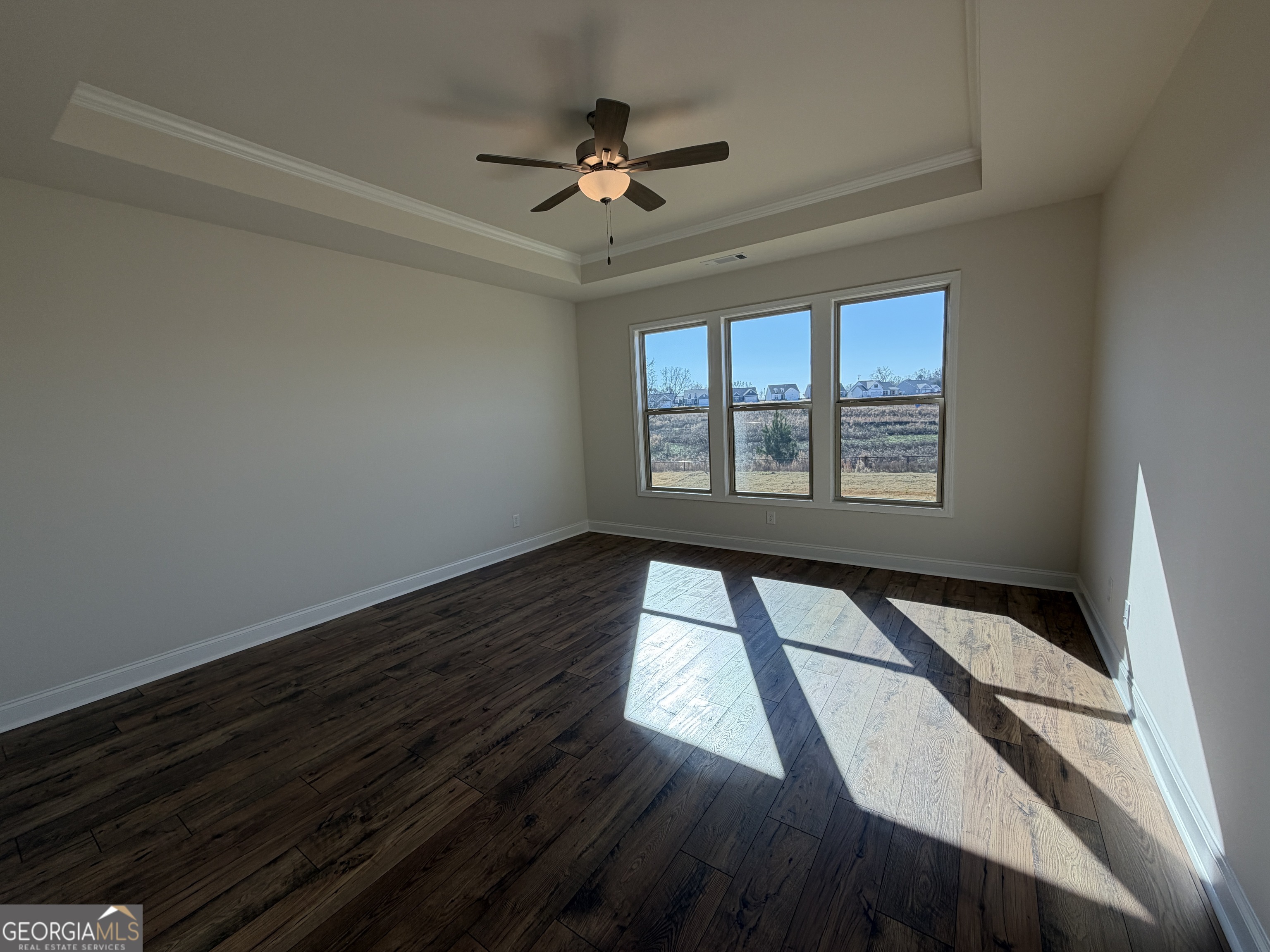 233 Oakdale Road, Unit 53 Jefferson, GA 30549 - Photo 25 of 64 Trey ceiling, crown molding, ceiling fan, wide planked laminate flooring, abundance of natural lighting.