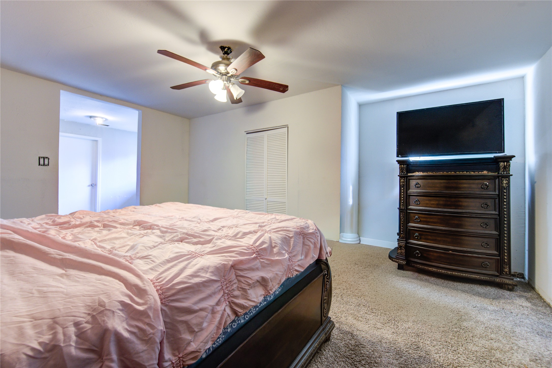 1219 Pilot Point Drive Houston, TX 77038 - Photo 13 of 19 a bedroom with a bed and a television