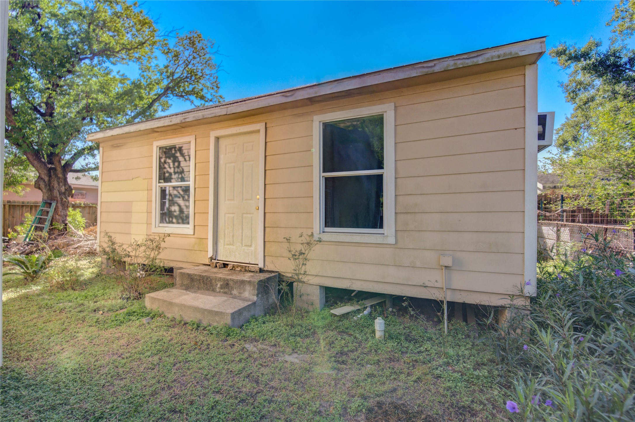 1219 Pilot Point Drive Houston, TX 77038 - Photo 17 of 19 a front view of a house with garden