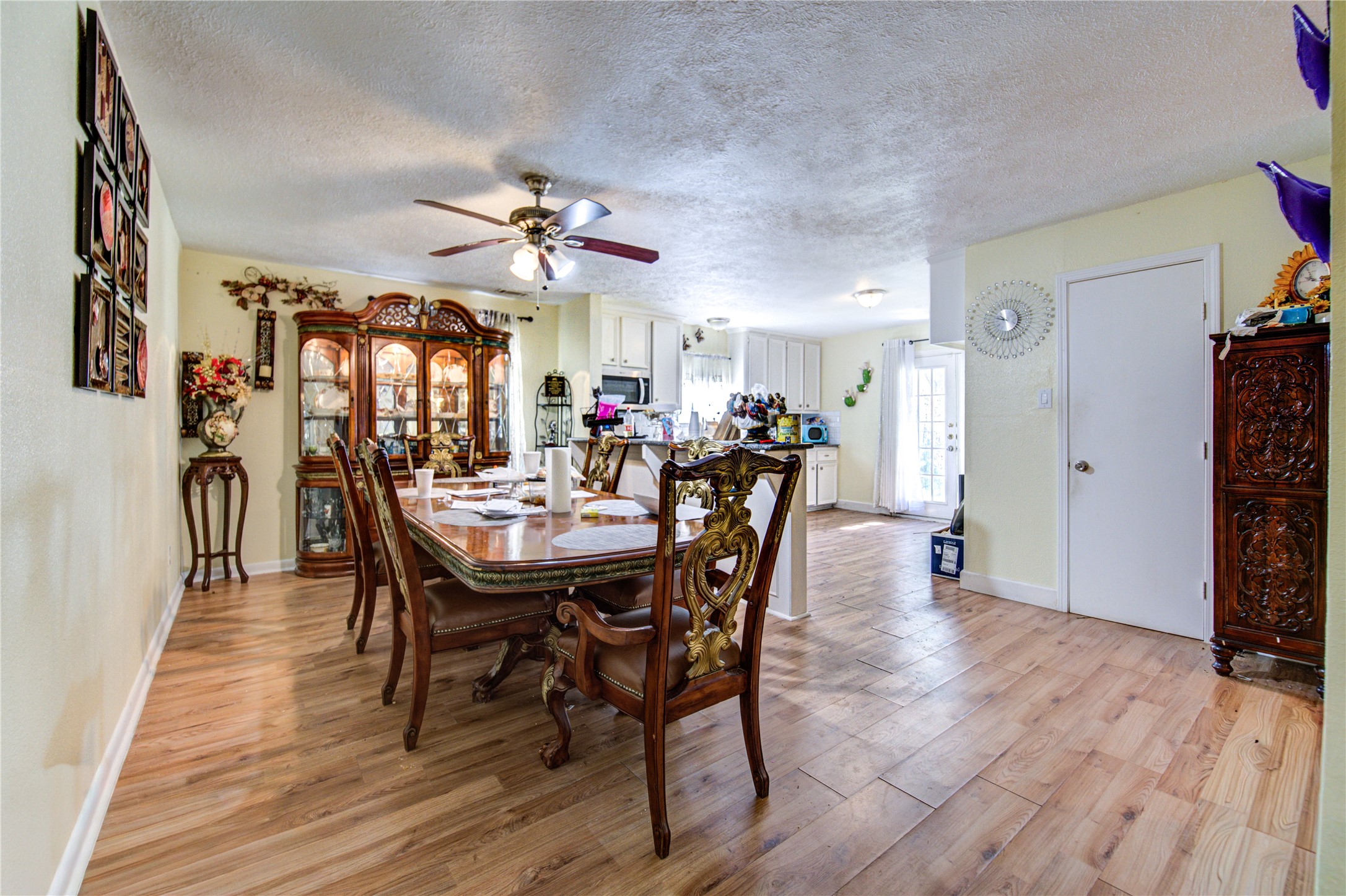 1219 Pilot Point Drive Houston, TX 77038 - Photo 5 of 19 a view of a a dining room with furniture window and wooden floor