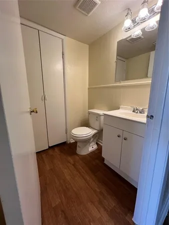 a bathroom with a toilet and a sink