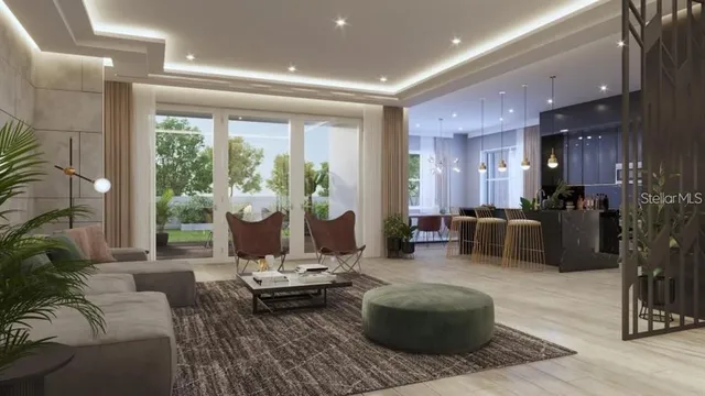 a living room with furniture and a floor to ceiling window