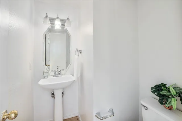a bathroom with a sink and mirror