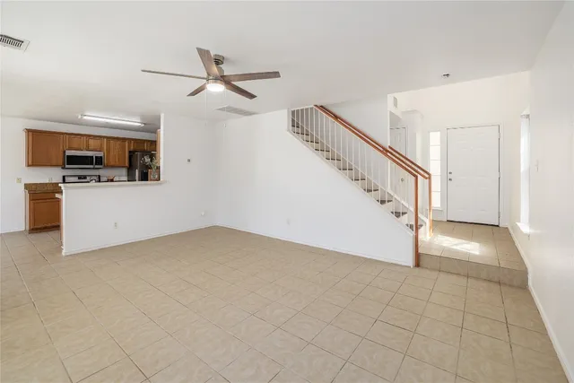 a view of a livingroom with a staircase