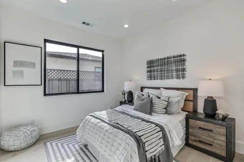 a bedroom with a bed and window