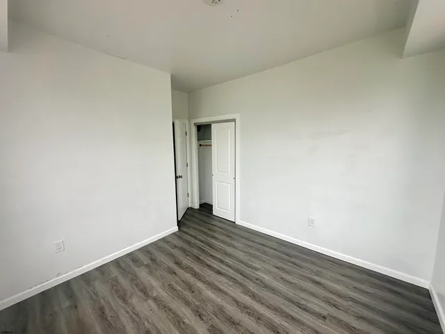 a kitchen with stainless steel appliances a stove a refrigerator and a microwave