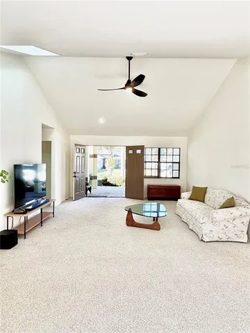 a bedroom with a bed furniture and next to a window