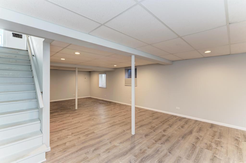 381 Pearson Circle Naperville, IL 60563 - Photo 20 of 43 a view of an empty room with wooden floor and entryway