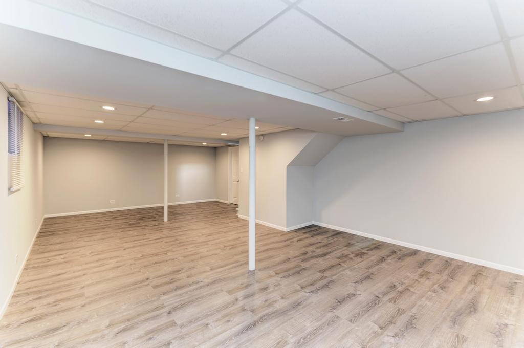 381 Pearson Circle Naperville, IL 60563 - Photo 22 of 43 a view of an empty room with wooden floor