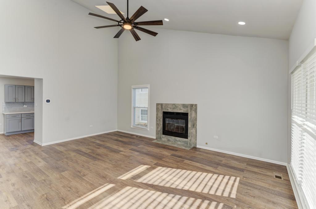 381 Pearson Circle Naperville, IL 60563 - Photo 31 of 43 en empty room with a fireplace and a window
