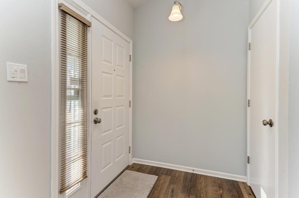 381 Pearson Circle Naperville, IL 60563 - Photo 32 of 43 a view of a hallway with wooden floor and closet
