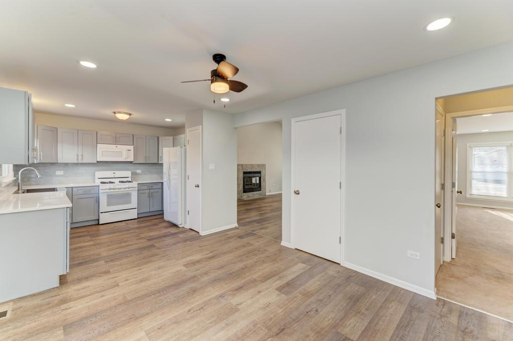 381 Pearson Circle Naperville, IL 60563 - Photo 38 of 43 a view of a kitchen with wooden floor and a sink