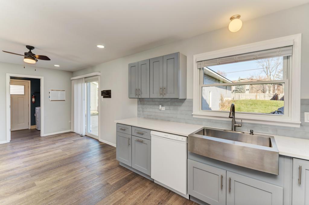 381 Pearson Circle Naperville, IL 60563 - Photo 6 of 43 a kitchen with a sink cabinets and window