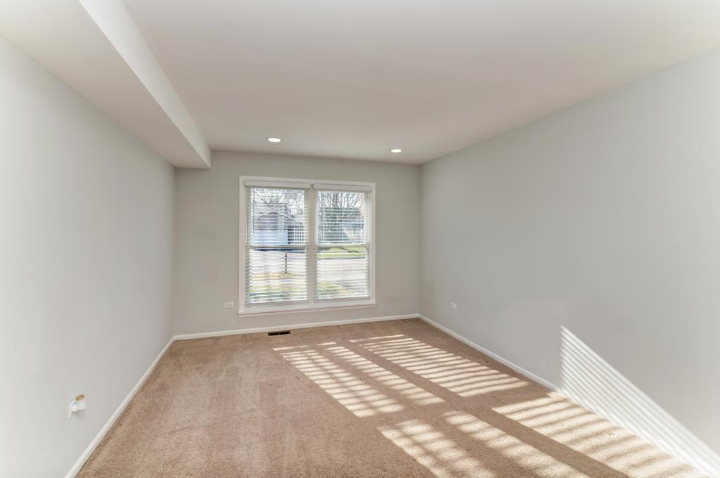 381 Pearson Circle Naperville, IL 60563 - Photo 9 of 43 an empty room with a window