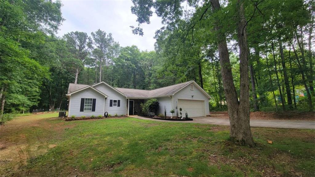 2140 Summerset Drive Monroe, GA 30656 - Photo 3 of 43 a front view of a house with yard and green space