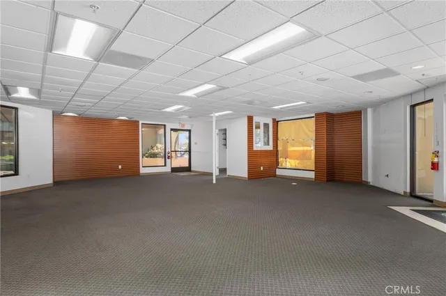 a view of an empty room with windows