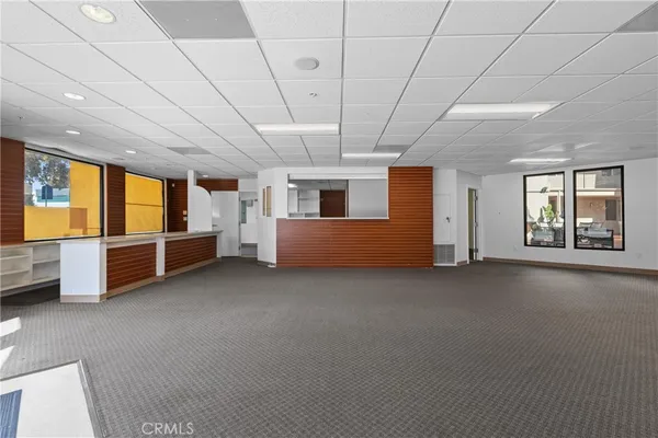 a view of an empty room with a fireplace