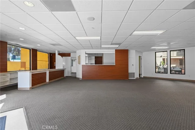 a view of an empty room with a fireplace