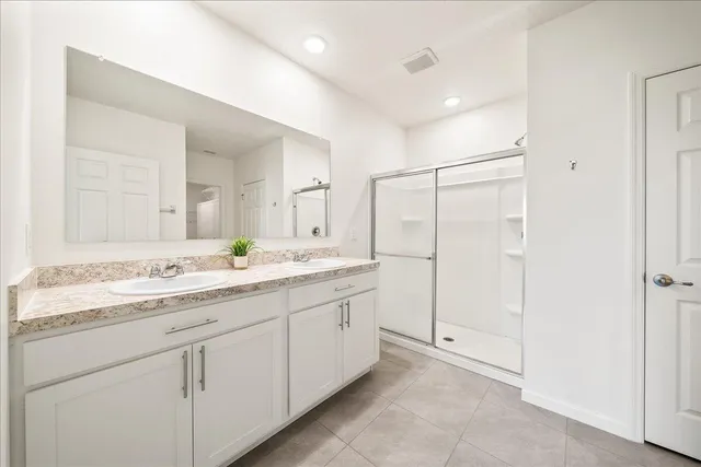 a view of a closet area with an empty room