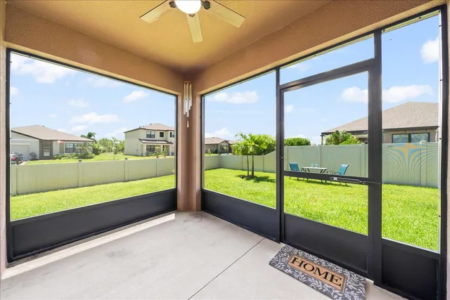 a view of a swimming pool with a patio and a yard