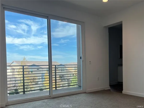 a view of a room with a large window