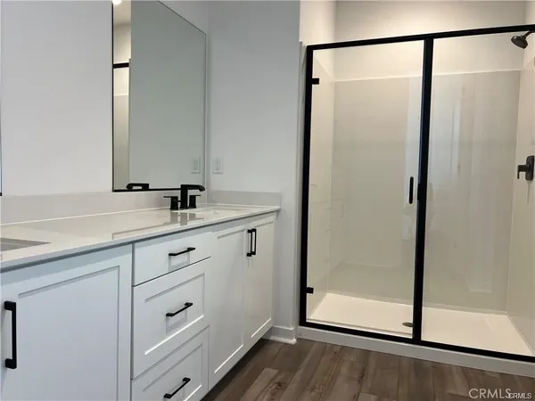 a bathroom with a toilet a sink and vanity