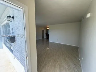 a view of a bathroom from a hallway