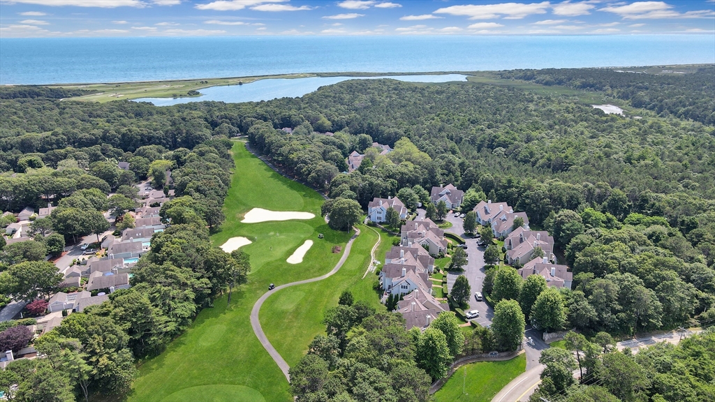 4 Quinns Way, Unit 4 Mashpee, MA 02649 - Photo 28 of 29 an aerial view of a golf course with houses