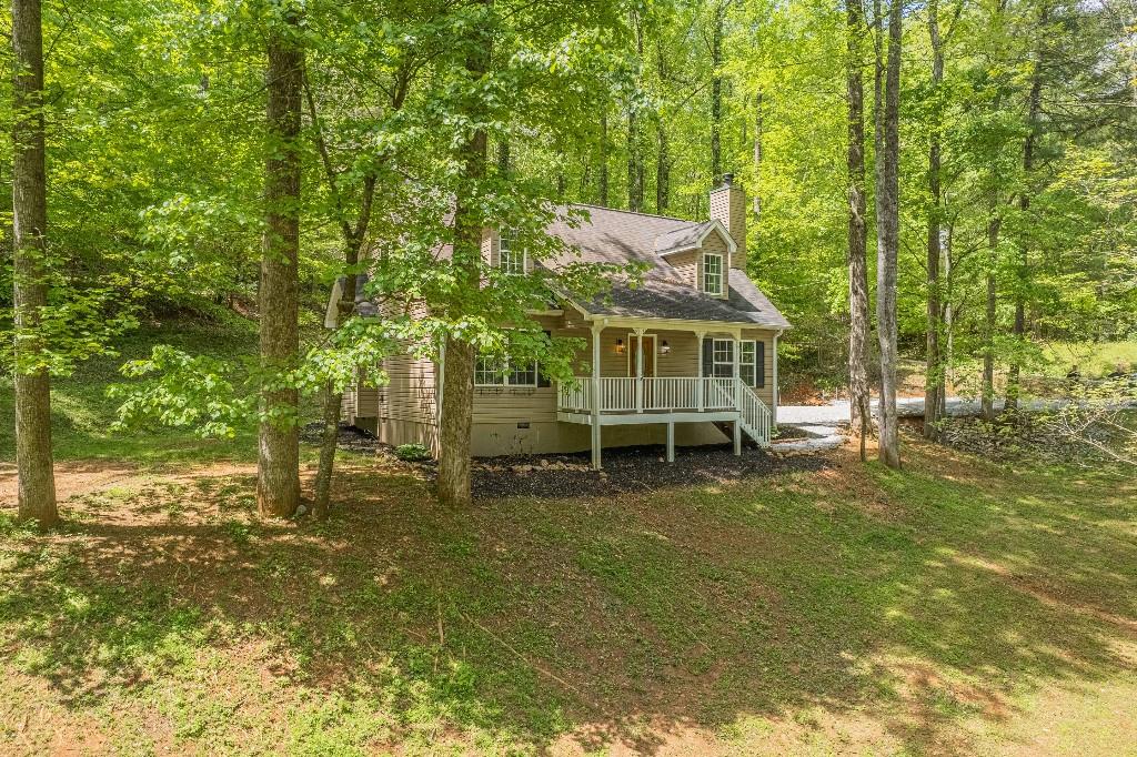 3090 Pierce Road Gainesville, GA 30507 - Photo 1 of 1 a view of a house with a yard balcony and sitting area