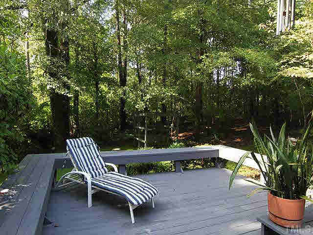2713 Sherborne Place Raleigh, NC 27612 - Photo 21 of 25 This is the lower sun deck looking out over the rear yard and plenty of privacy woods. This deck was completely rebuilt in 2010. Patio/Deck