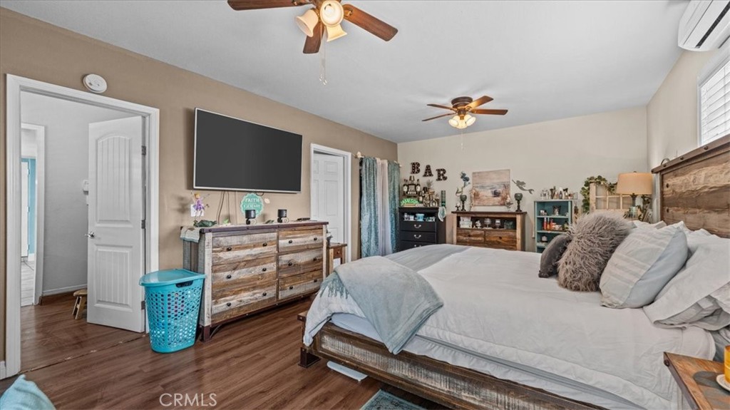 8715 Lurline Street Rancho Cucamonga, CA 91701 - Photo 25 of 41 a bedroom with a bed and a flat screen tv