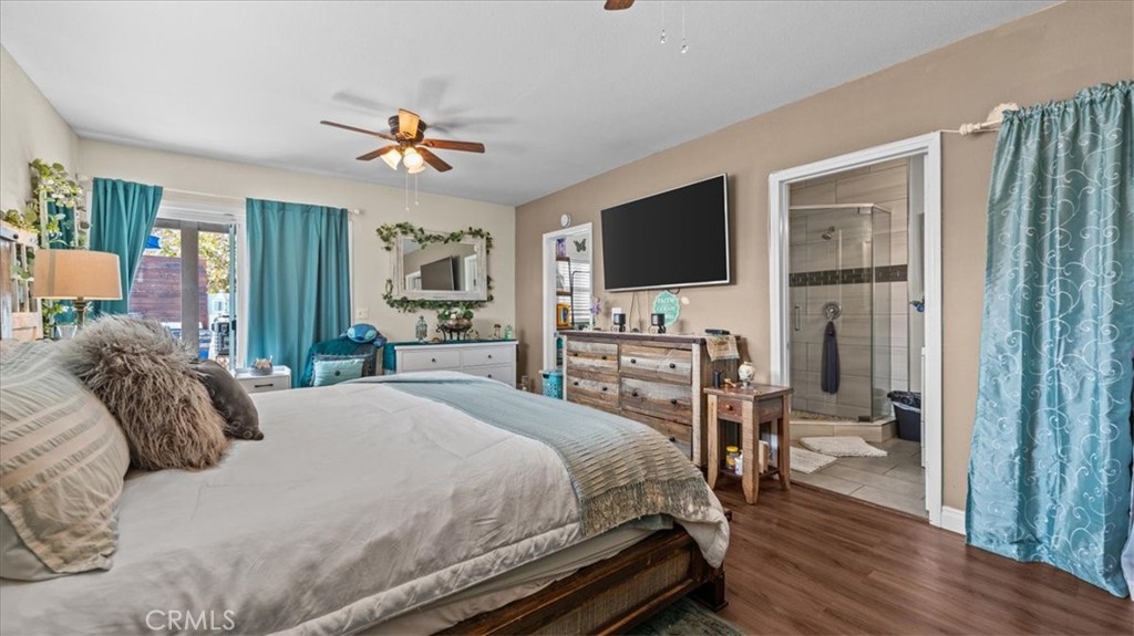 8715 Lurline Street Rancho Cucamonga, CA 91701 - Photo 26 of 41 a bedroom with a bed and a flat screen tv