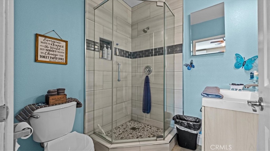 8715 Lurline Street Rancho Cucamonga, CA 91701 - Photo 27 of 41 a bathroom with a toilet and shower