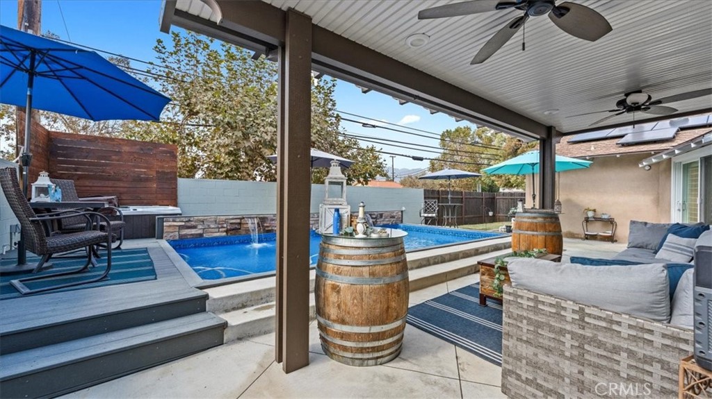 8715 Lurline Street Rancho Cucamonga, CA 91701 - Photo 29 of 41 a outdoor space with the couches and dining table with the garden view