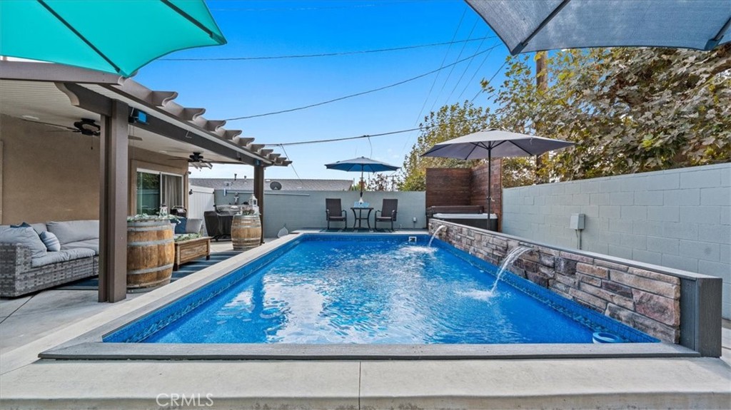 8715 Lurline Street Rancho Cucamonga, CA 91701 - Photo 32 of 41 a view of a living room and a wooden floor