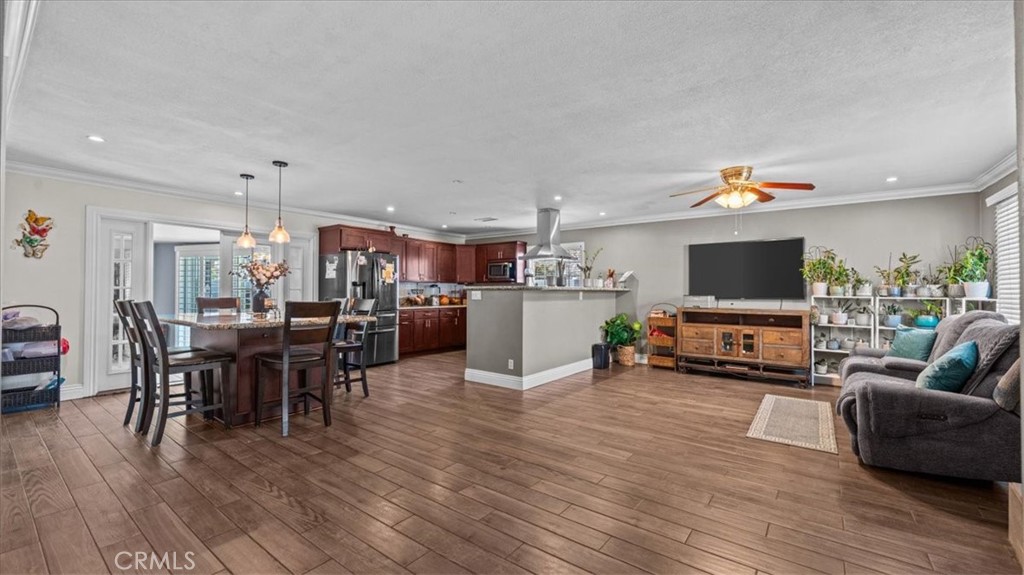 8715 Lurline Street Rancho Cucamonga, CA 91701 - Photo 5 of 41 a living room with furniture and a flat screen tv