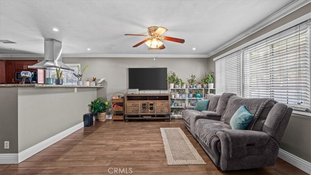 8715 Lurline Street Rancho Cucamonga, CA 91701 - Photo 7 of 41 a living room with furniture and a flat screen tv